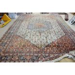 A Sarough carpet, Persian, the ivory herate field with a matching bold madder and indigo medallion,