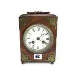 An oak cased mantel clock, late 19th century,