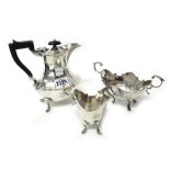 A silver three piece matched part tea set, comprising; a hot water jug, with wooden fittings,