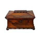 A late Regency rosewood tea caddy of sarcophagus form, with twin lidded interior,