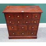 A small 20th century hardwood apothecary cabinet, with fourteen various drawers,