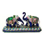 An Indian enamelled model of two elephants,