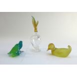 A pair of Daum coloured glass budgerigars atop a branch, etched 'Daum France', 7cm high,