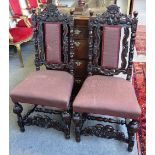 A pair of Carolean style oak framed side chairs, with carved decoration and bulbous supports,