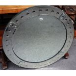 A 20th century circular Venetian style wall mirror, with convex decoration, 93cm wide.