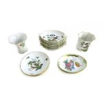 A set of eight Herend porcelain oval ashtrays decorated with wild birds and insects, 11.