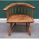 A George III West Country stick back chair, with three piece rail and solid seat on staked supports,