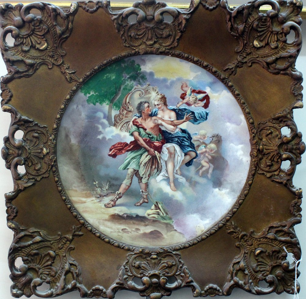 A pair of continental ceramic wall plates, circa 1900, decorated with classical figural scenes,