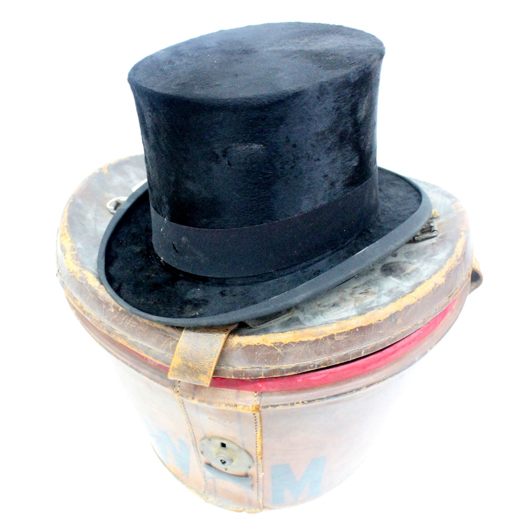 A vintage black silk top hat, labelled and stamped 'Tress & Co London',