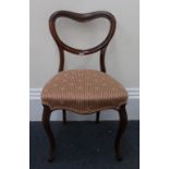A set of six Victorian rosewood balloon back dining chairs, with upholstered stuff over seats,