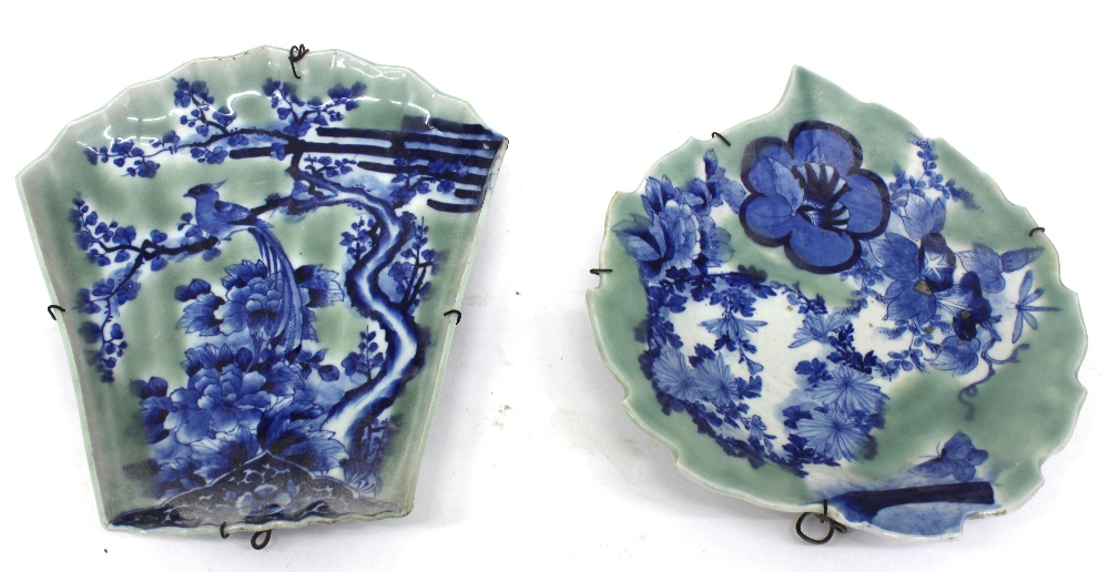 Two Japanese porcelain dishes, Meiji, of fan and leaf shape, painted in blue with a bird,