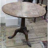 An early George III oak tea table,