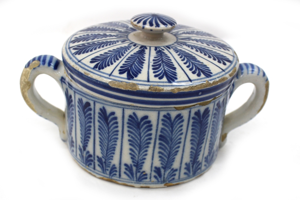 A Dutch Delft blue and white two handed posset pot and cover, circa 1770,