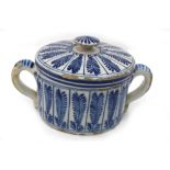 A Dutch Delft blue and white two handed posset pot and cover, circa 1770,