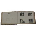 A vintage photograph album and scrap book with annotated photographs and sketches of country house