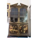A reproduction George III style chinoisserie decorated bookcase cabinet,