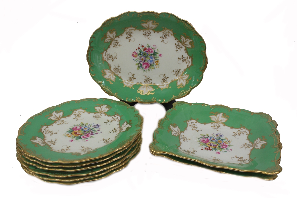 A Minton porcelain nine piece dessert service, centrally painted with a bouquet of flowers,