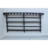 A late Victorian carved oak two tier Delft rack, in earlier style, with arcaded cornice,