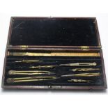 A Victorian rectangular mahogany case of brass drawing instruments,