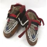 A pair of 19th Century Native American Iroquois Indian child's beadwork moccasins