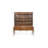 A George III oak and mahogany crossbanded dresser, the upper section with three shelves,