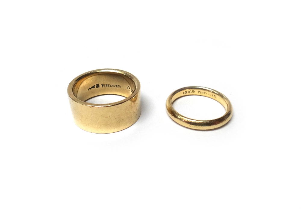 A Tiffany & Co wide band wedding ring, detailed 14 KT, Tiffany & Co and engraved with initials,