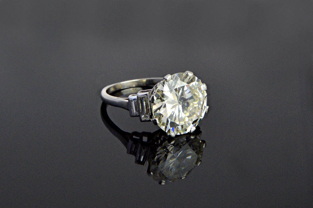 A single stone diamond ring, the principal round brilliant cut diamond weighs approximately 5.