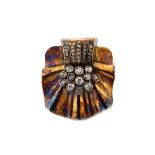 A gold and diamond brooch, in a fanned and ridged design, in the Art Deco taste,