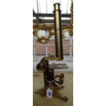 A Baker gilt brass microscope 19th century With rack and pinion adjustment,