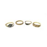 A 9ct gold, emerald and diamond set three stone ring, a gold and colourless gem set half hoop ring,