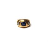 A gold, synthetic sapphire and diamond set three stone ring,