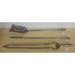 A set of Victorian steel fire tools, with ribbed handles, the pierced shovel 68cm,