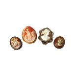 A gold mounted oval shell cameo brooch, carved as a female figure, with a cherub and a dog,