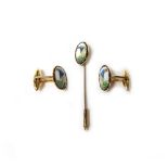 A pair of gold and enamelled cufflinks,