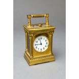 An unusual French gilt metal miniature minute repeating carriage timepiece Circa 1910, No.