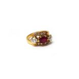 A gold, ruby and diamond set ring,
