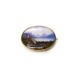 A gold mounted, Swiss enamelled oval brooch, depicting an alpine scene,
