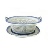 A Chinese pierced blue and white oval two-handled basket and stand,