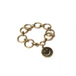 A gold circular and oval link bracelet, detailed 14 K, on a boltring clasp,
