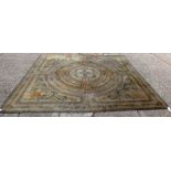 A Savonnerie carpet, the central ivory roundel with an indigo cross, outer surrounds,