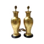 A pair of William Mehornay lamps, gilt ceramic,