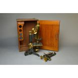 A patinated and gilt brass microscope By W.