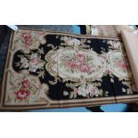 An Aubusson floral tapestry panel, the brown field with a central bouquet, outer bouquets to border,