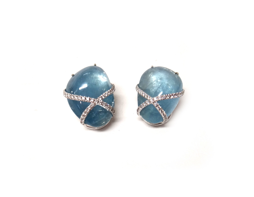 A pair of white gold mounted, aquamarine and diamond set earclips,