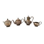 A French four piece tea and coffee set, comprising; a teapot, a twin handled sugar bowl and cover,