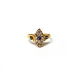 An 18ct gold, diamond and sapphire set marquise shaped cluster ring,