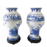 A pair of Japanese blue and white Seto ware vases, Meiji period, of baluster form with ring handles,