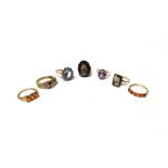 Seven various 9ct gold and gem set rings, to include; a diamond set ring designed as a belt buckle,