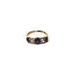 An 18ct gold, sapphire and diamond three stone ring,