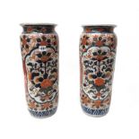 A pair of tall Japanese Imari cylindrical vases, Meiji period,
